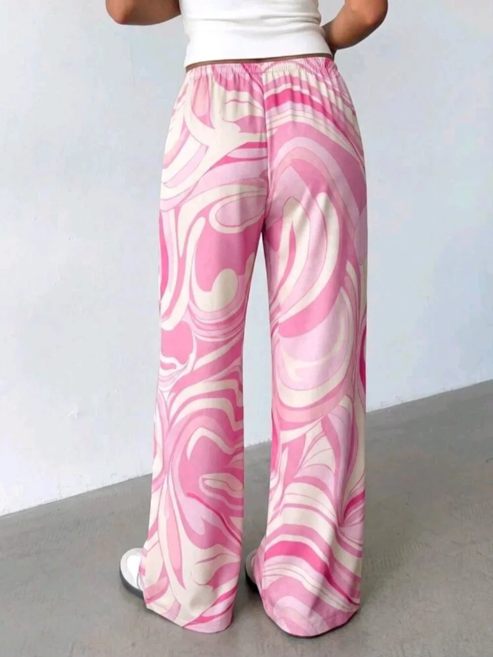 Women's loose-fitting satin pants with a low rise
